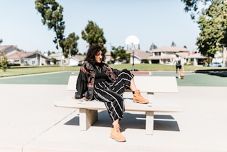 A stylish NBA player off the court wearing a trendy streetwear outfit.