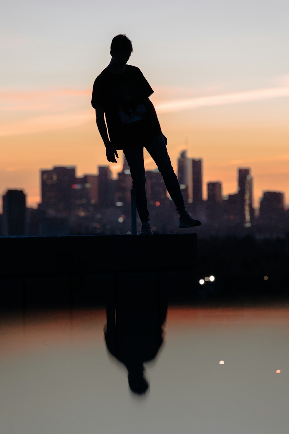 silhouette photograph of person lifting its foot