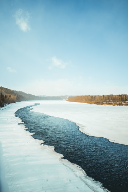 body of water under blue sky in Edmonton Canada