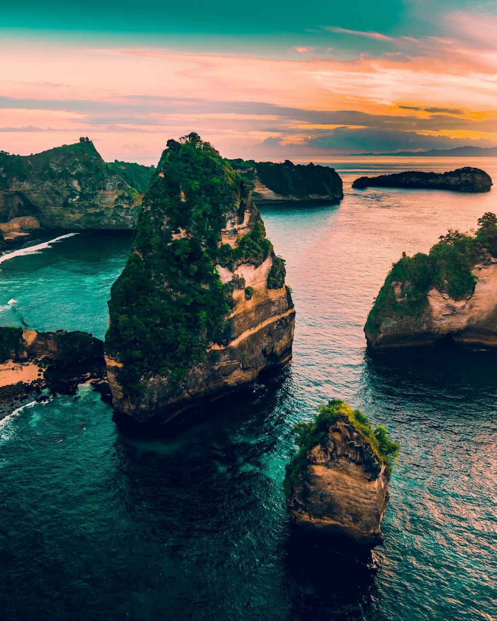 rock formations on body of water