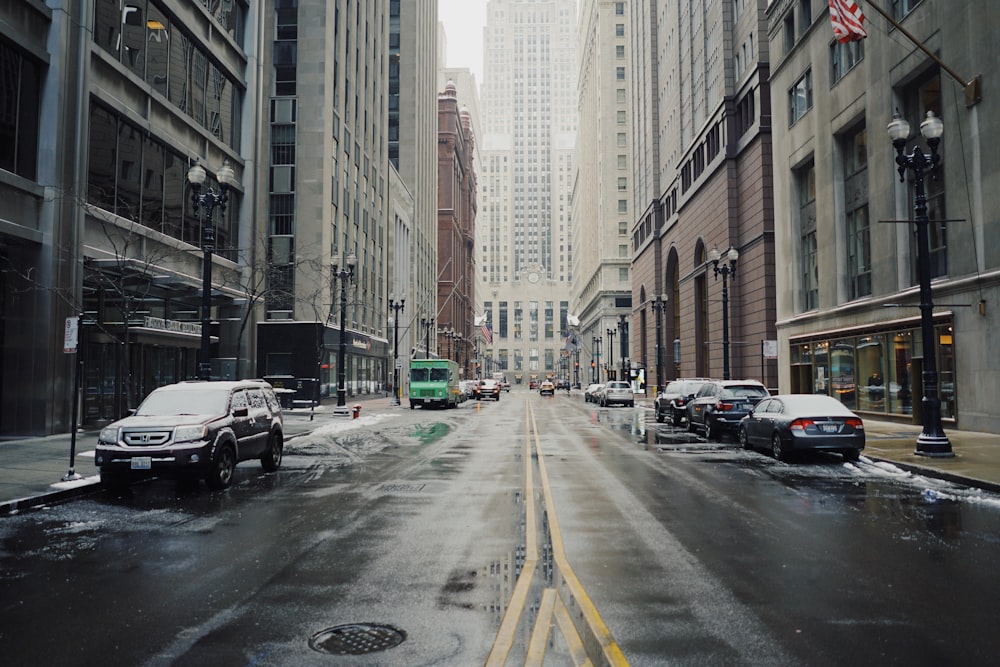 parked vehicles beside road and building at daytime