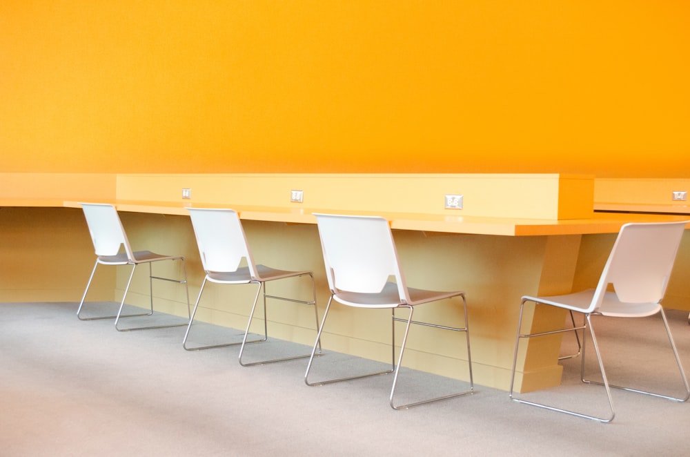 four chairs near desk