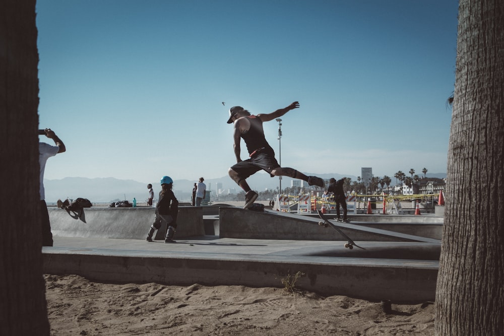 person jumping on skateboard on park