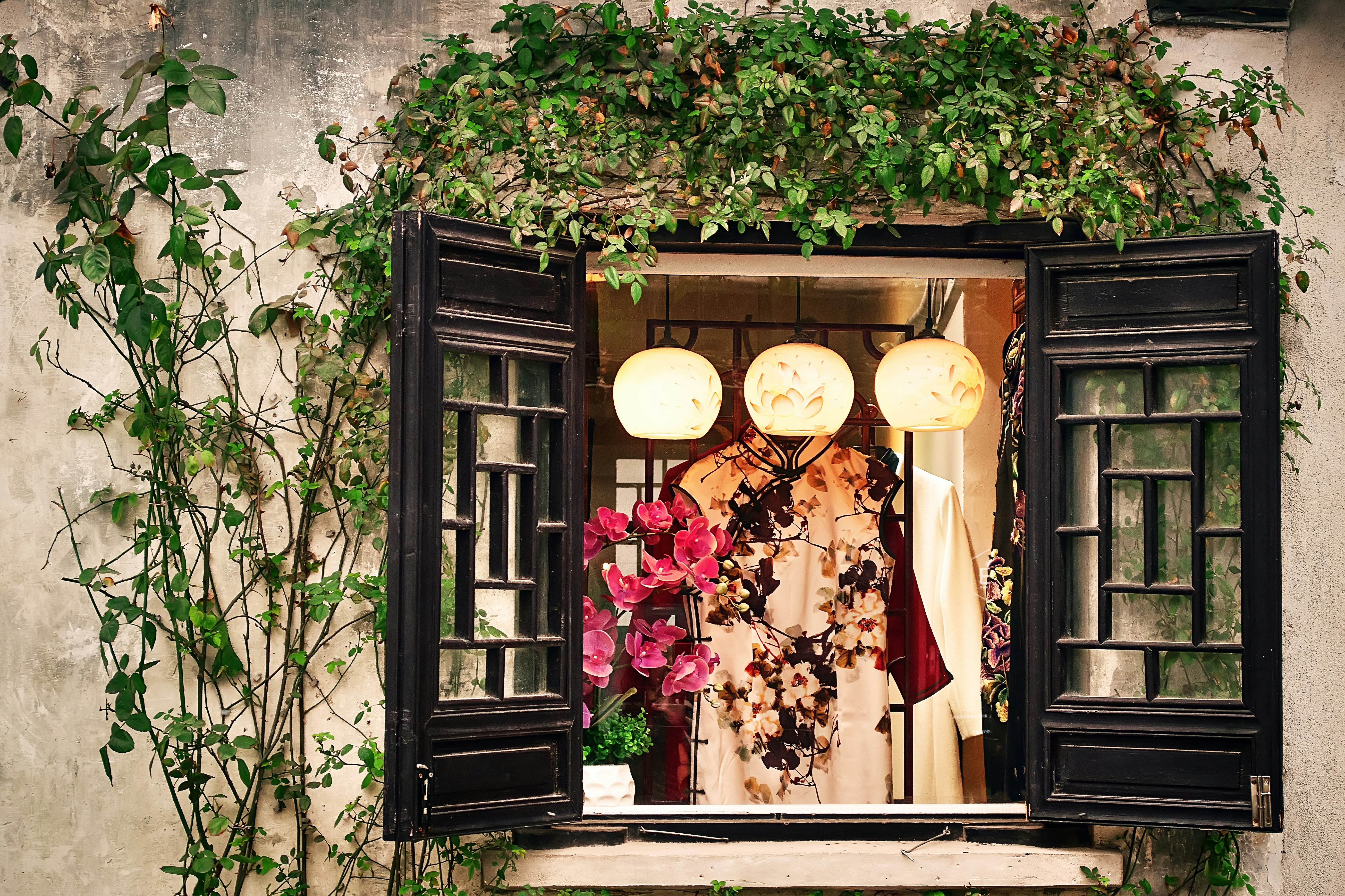 white and red floral dress near window