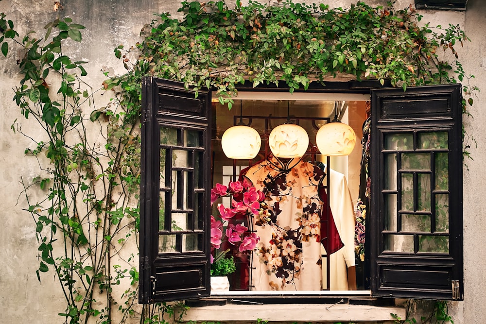 white and red floral dress near window