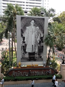 A warm portrait of Luis Alpuin smiling confidently in front of a modern home in Villahermosa.