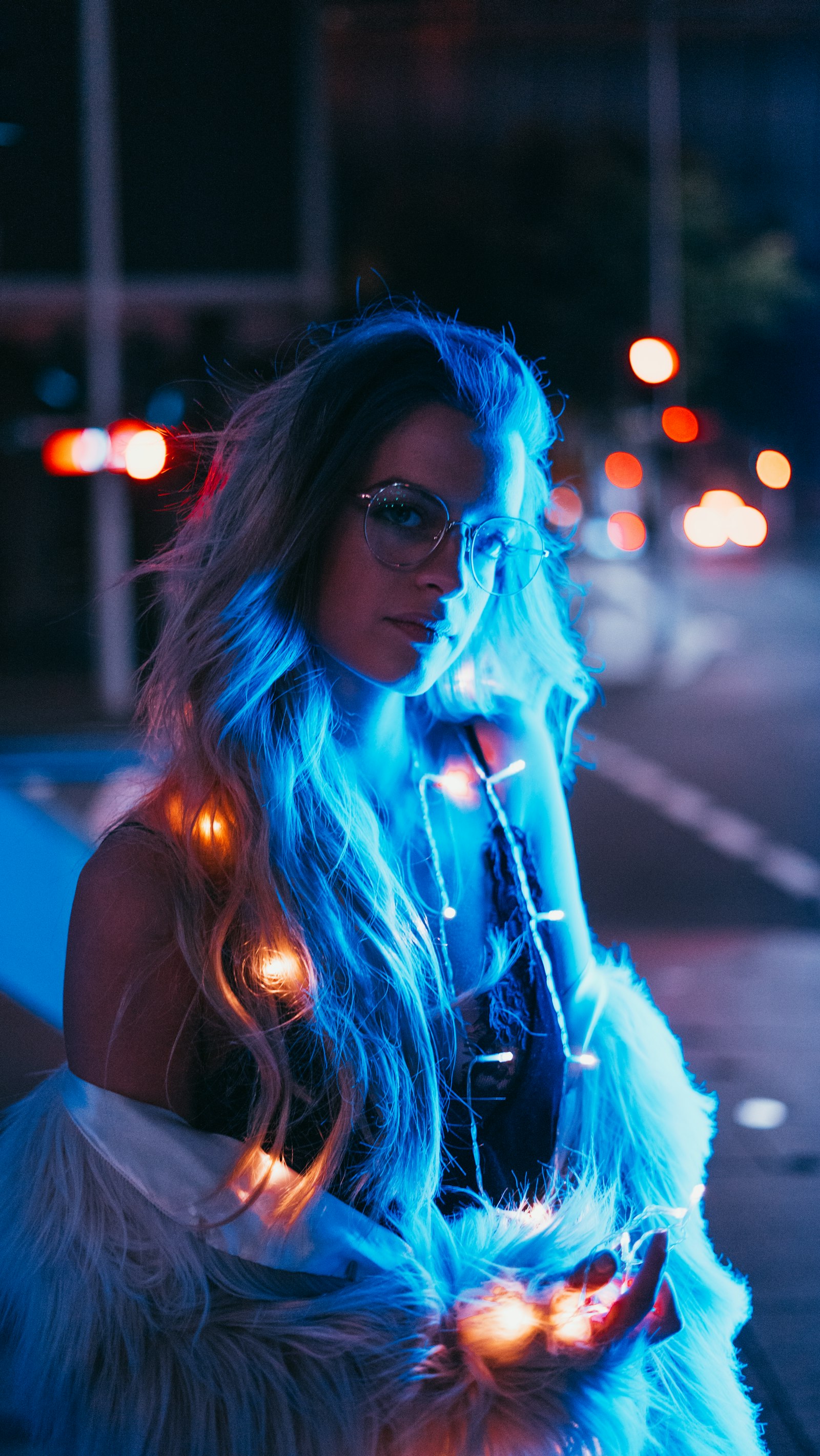 Sony a7R + Sony FE 50mm F1.8 sample photo. Woman wearing string lights photography
