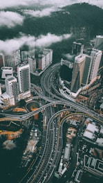 bird's eye view photography of high-rise buildings and bridges