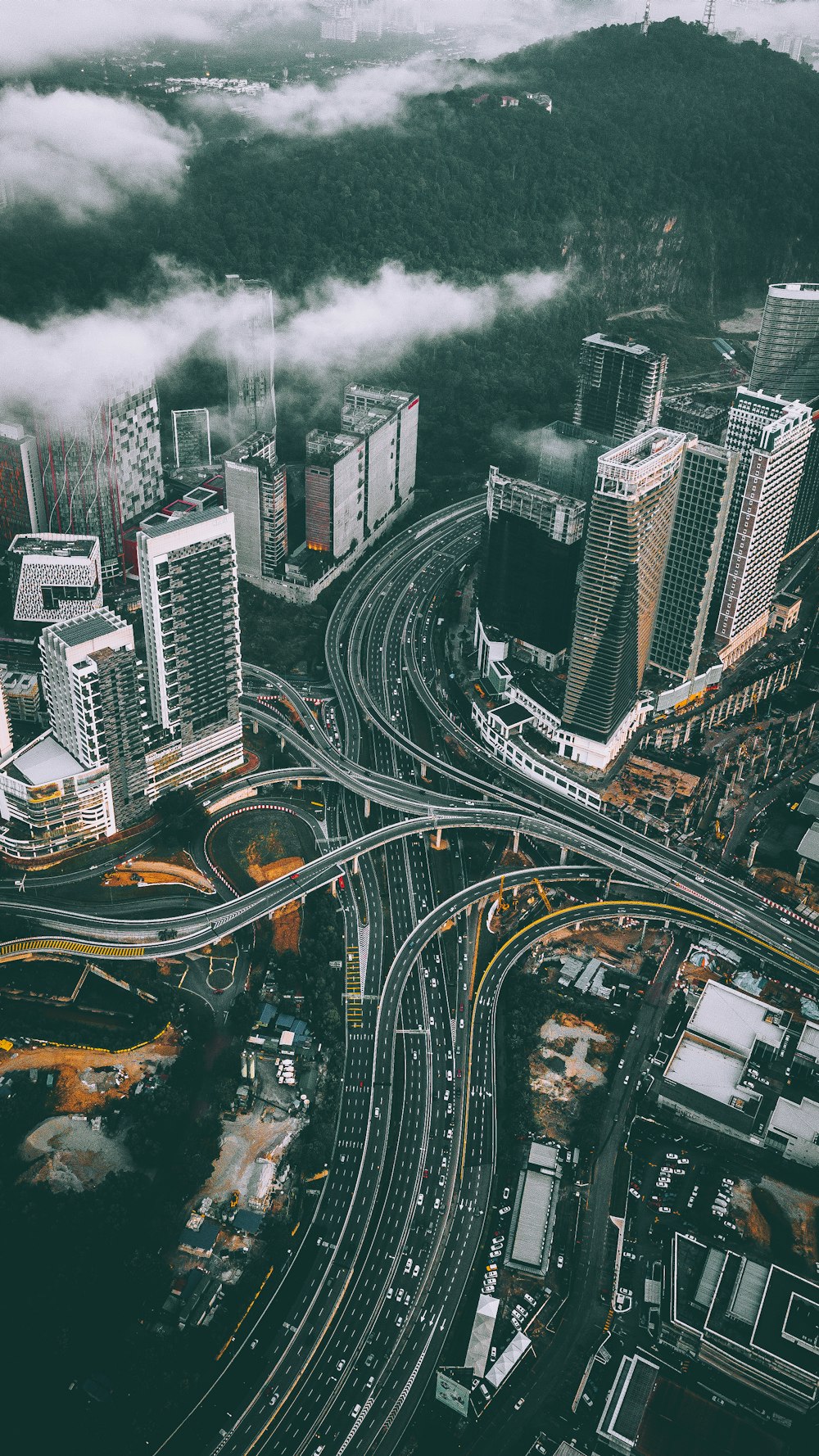 bird's eye view photography of high-rise buildings and bridges