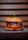 selective focus photography of burger on top of table