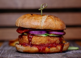 selective focus photography of burger on top of table