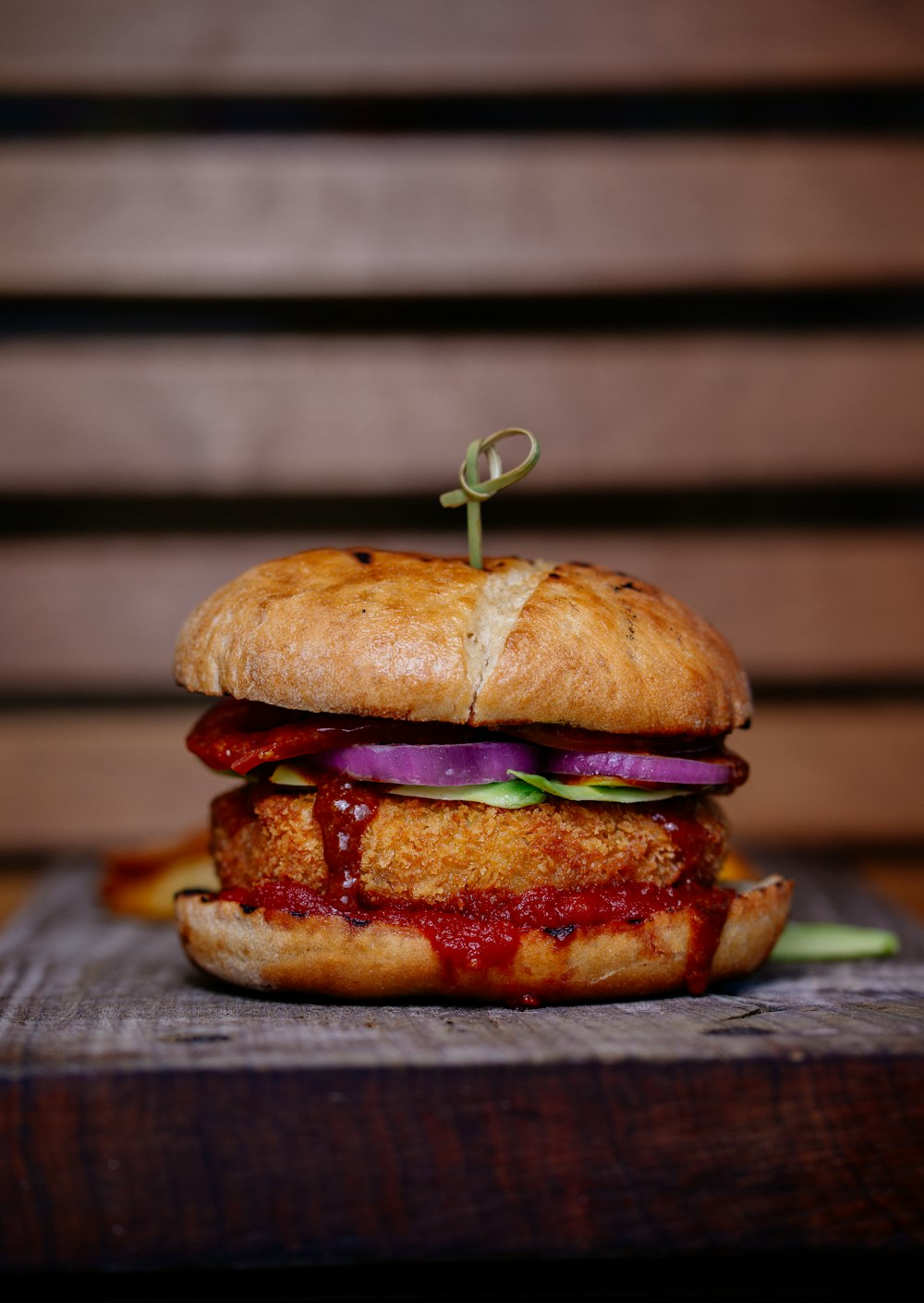 selective focus photography of burger on top of table