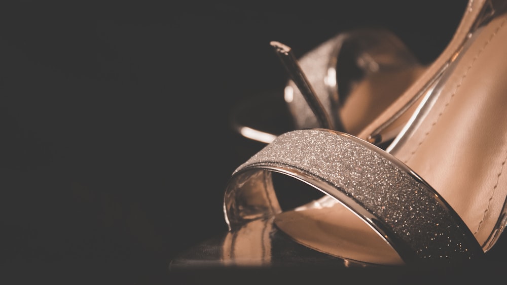 closeup photo of brown and gray open-toe sandal