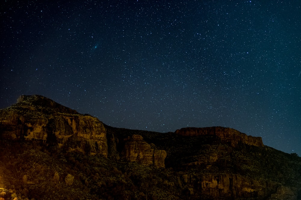 rock mountain under starry night