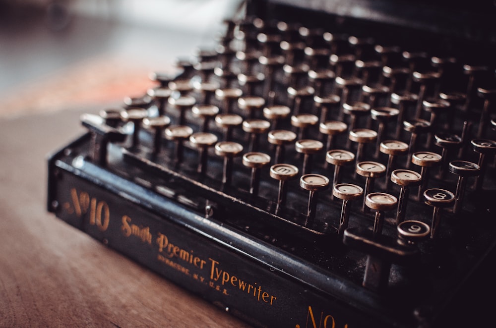 black typewriter on brown panel