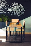 rectangular brown wooden table with chairs