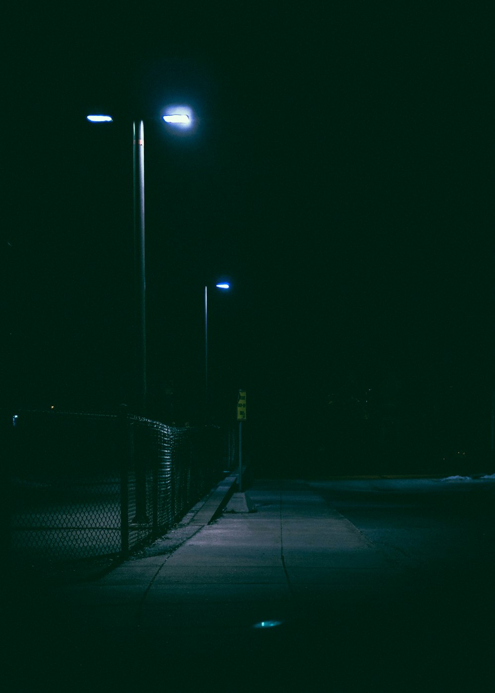 lighted street post at nighttime