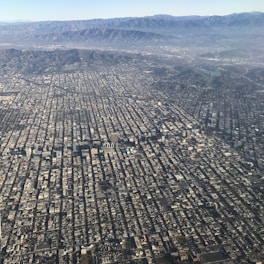Aerial view of a large urban area mapped with digital overlays showing topographical details.