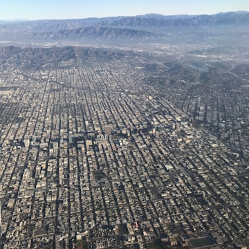 Aerial view of a large urban area mapped with digital overlays showing topographical details.