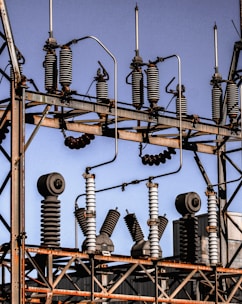 Close-up of high-quality electrical transformers and cables arranged neatly in a warehouse.