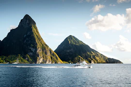 white yacht on body of water