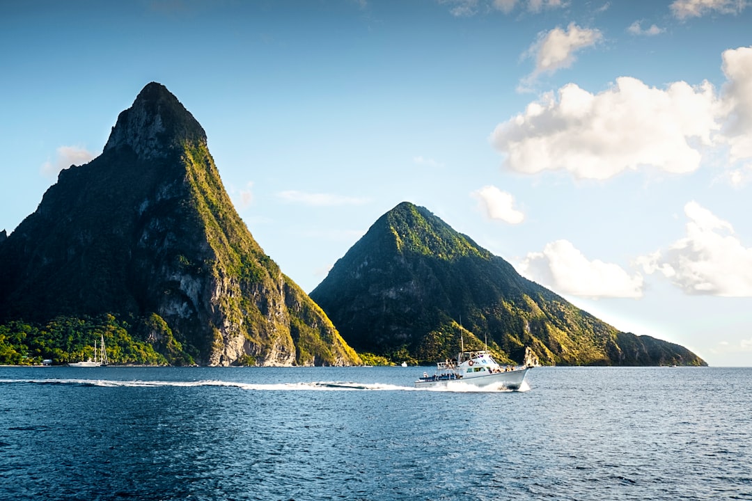 white yacht on body of water