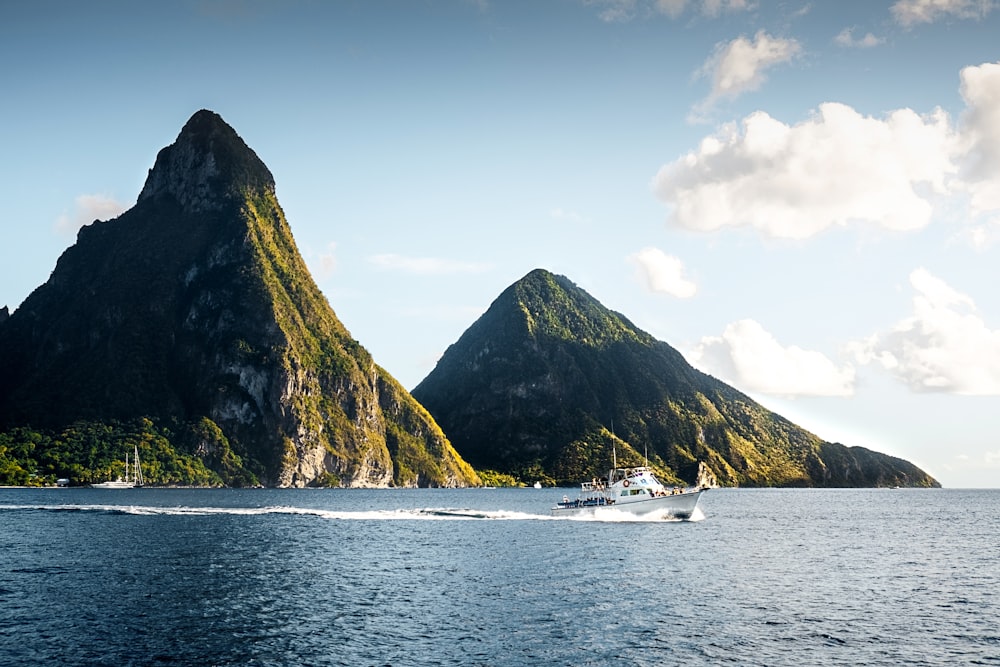 white yacht on body of water