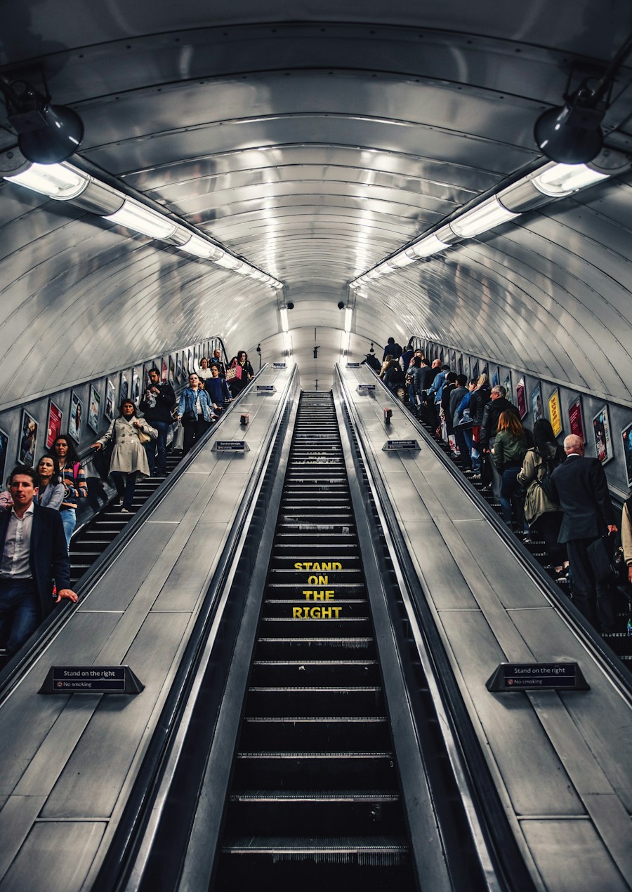 Commuters on a long London Underground escalator, placeholder city culture image