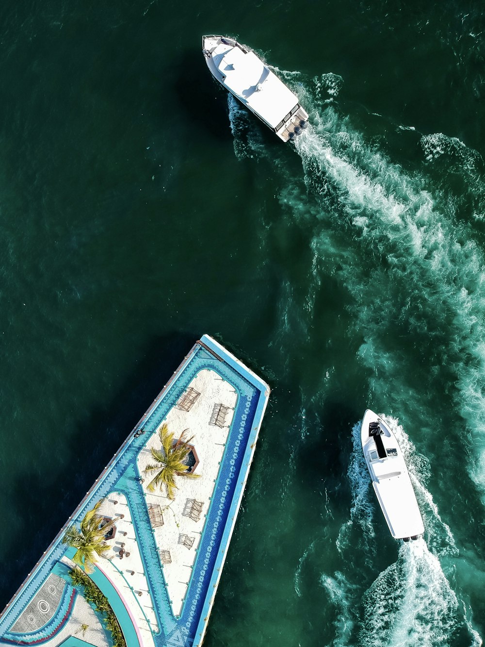 aerial photo of two boats on ocean