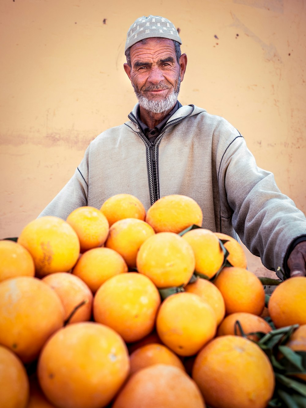 man holding oranges
