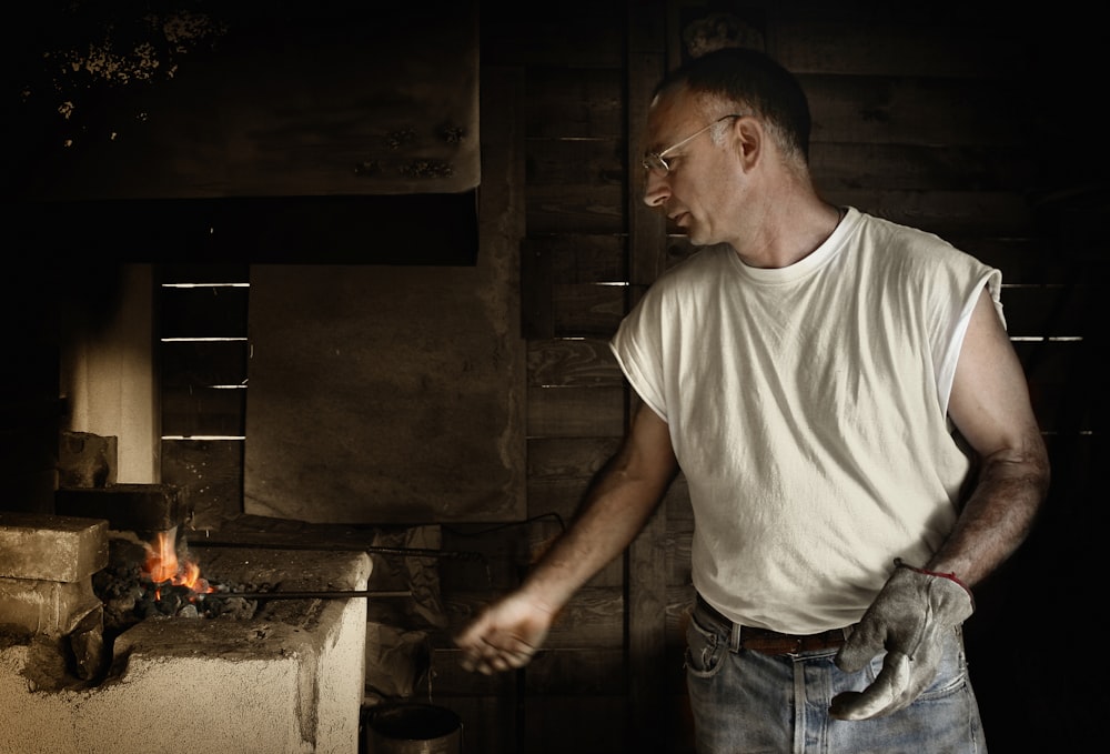 man standing near burner