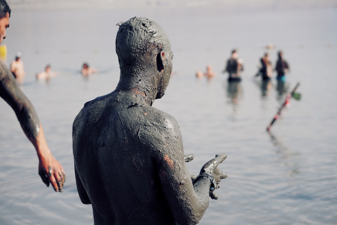 person with mud bleach looking sideways,
