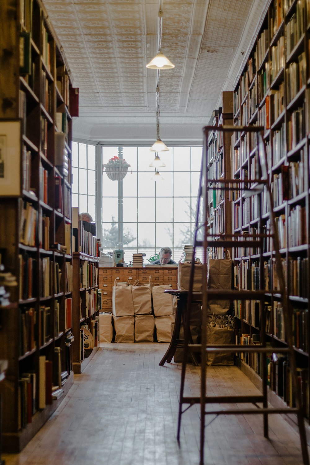 man sitting inside librabry