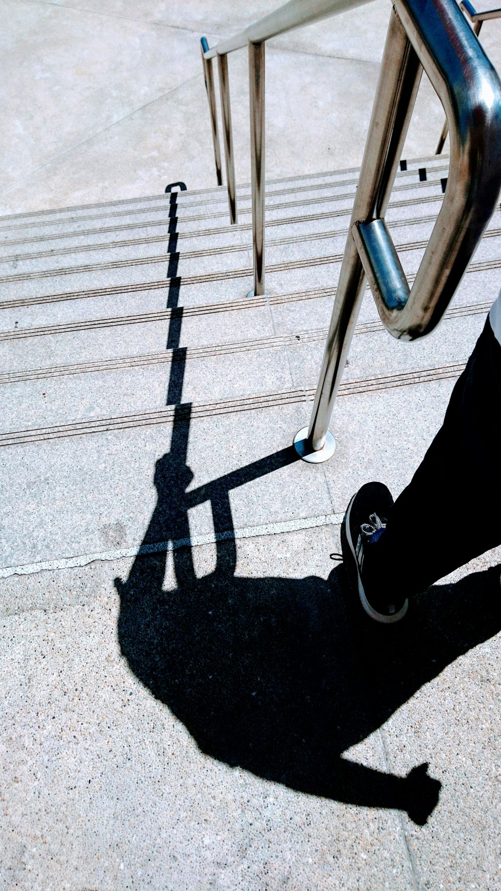 shadow of a person standing on staircase