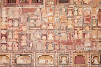 Close-up of detailed decorative painting with warm earth tones