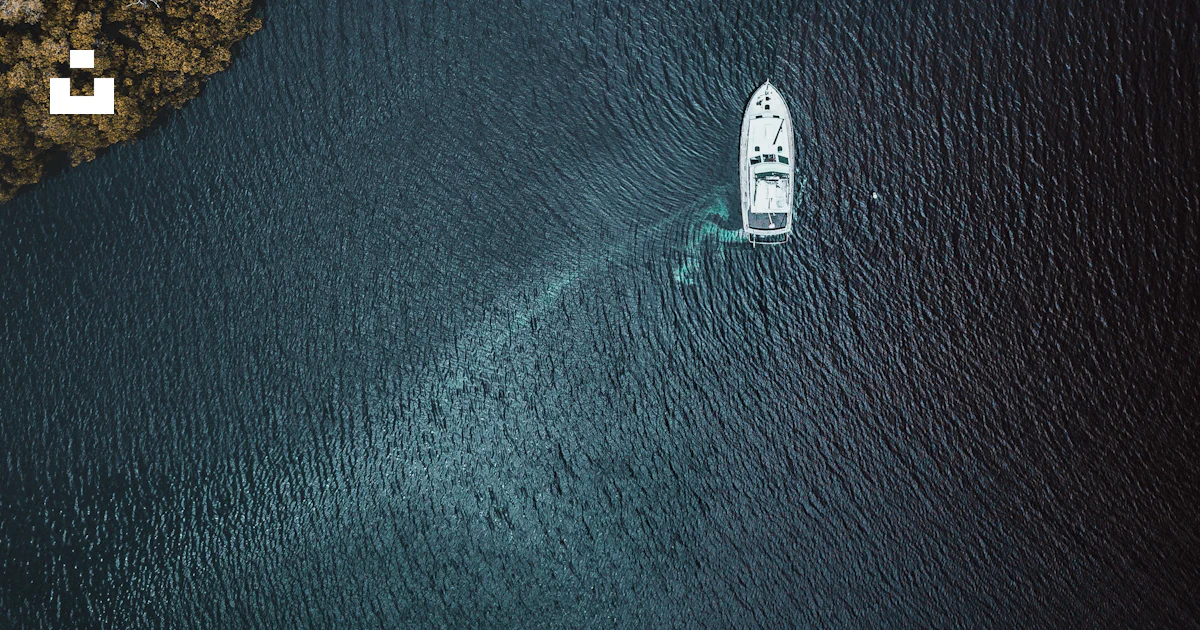 Bird's-eye view of boat on body of water photo – Free Aerial Image on ...