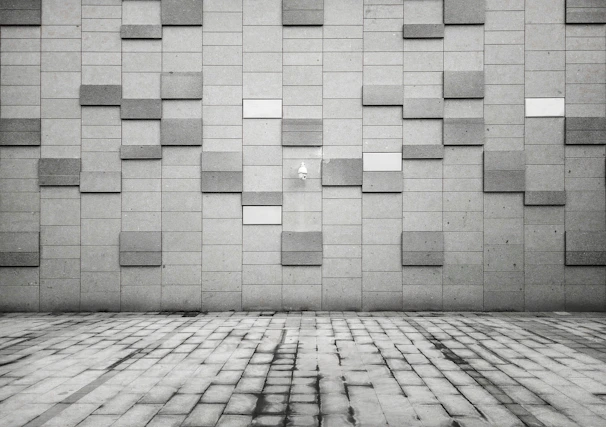 Close-up of sleek, modern gray outdoor tiles arranged in a geometric pattern.