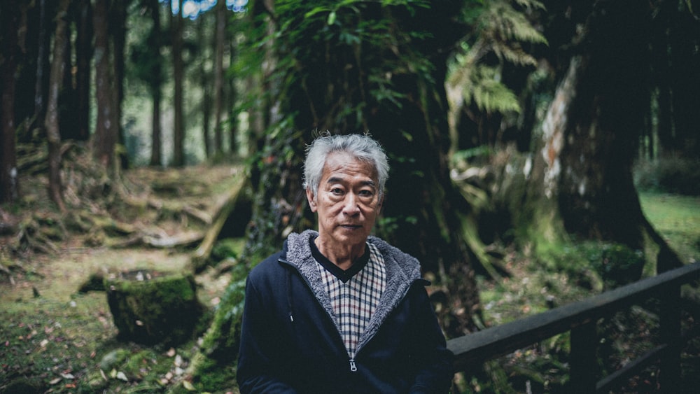 man wearing jacket neat tree outdoor