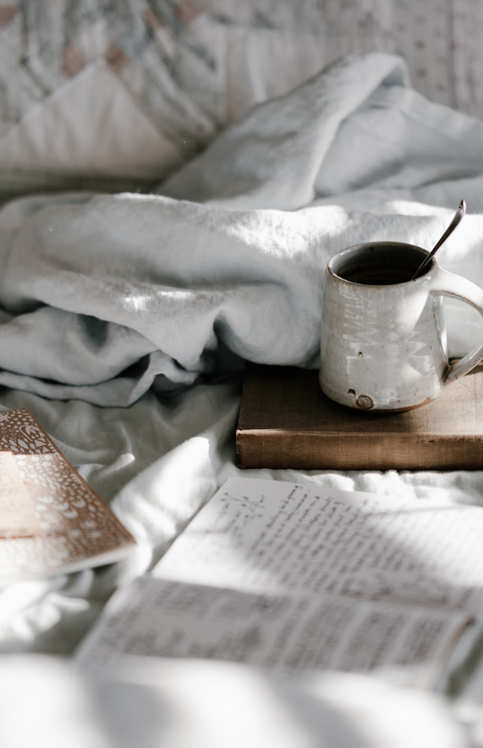 white and gray bed sheet