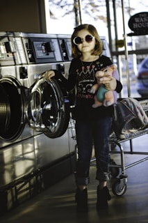 girl about to wash her plush toy