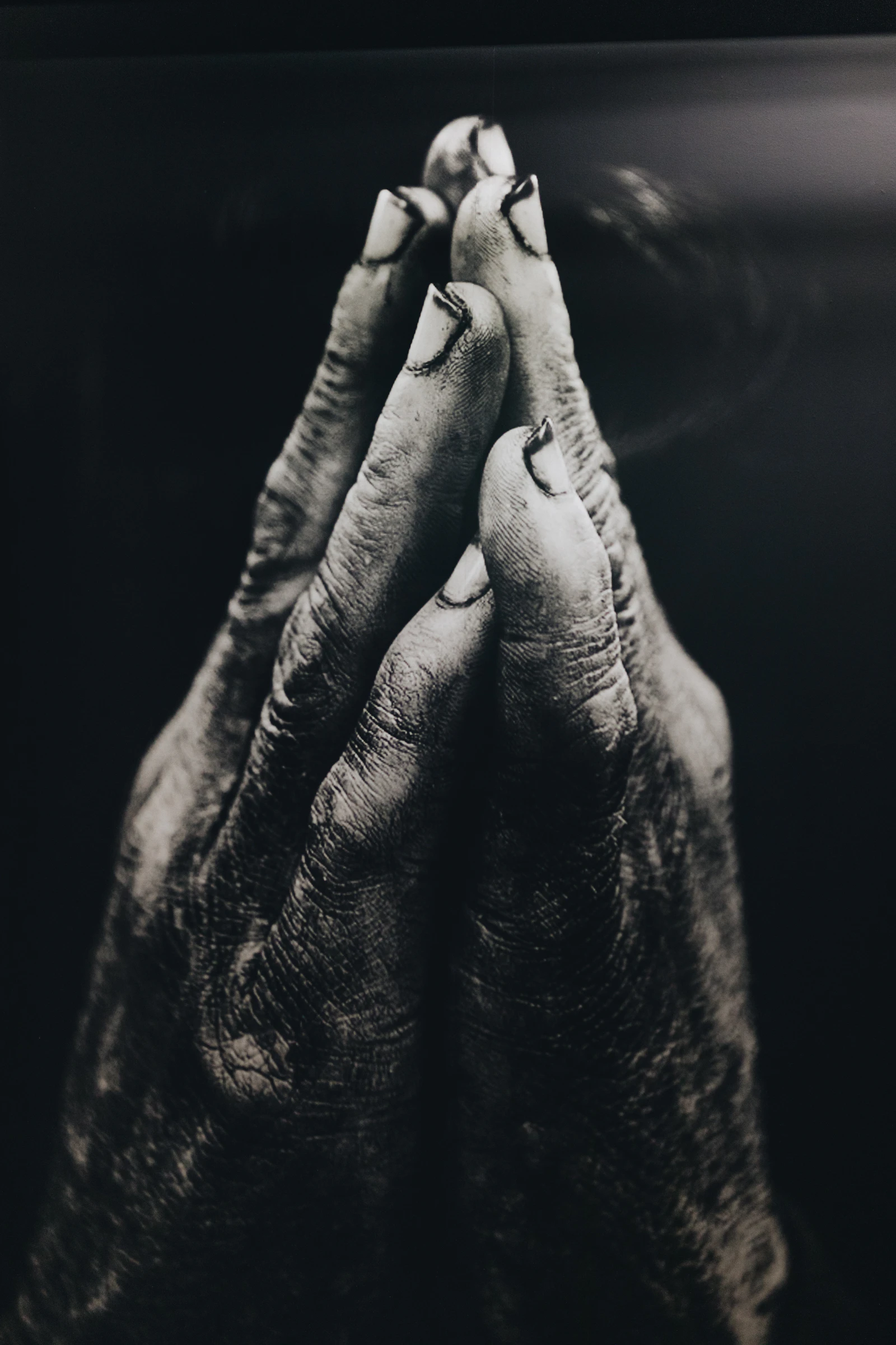 Hands clasped in prayer