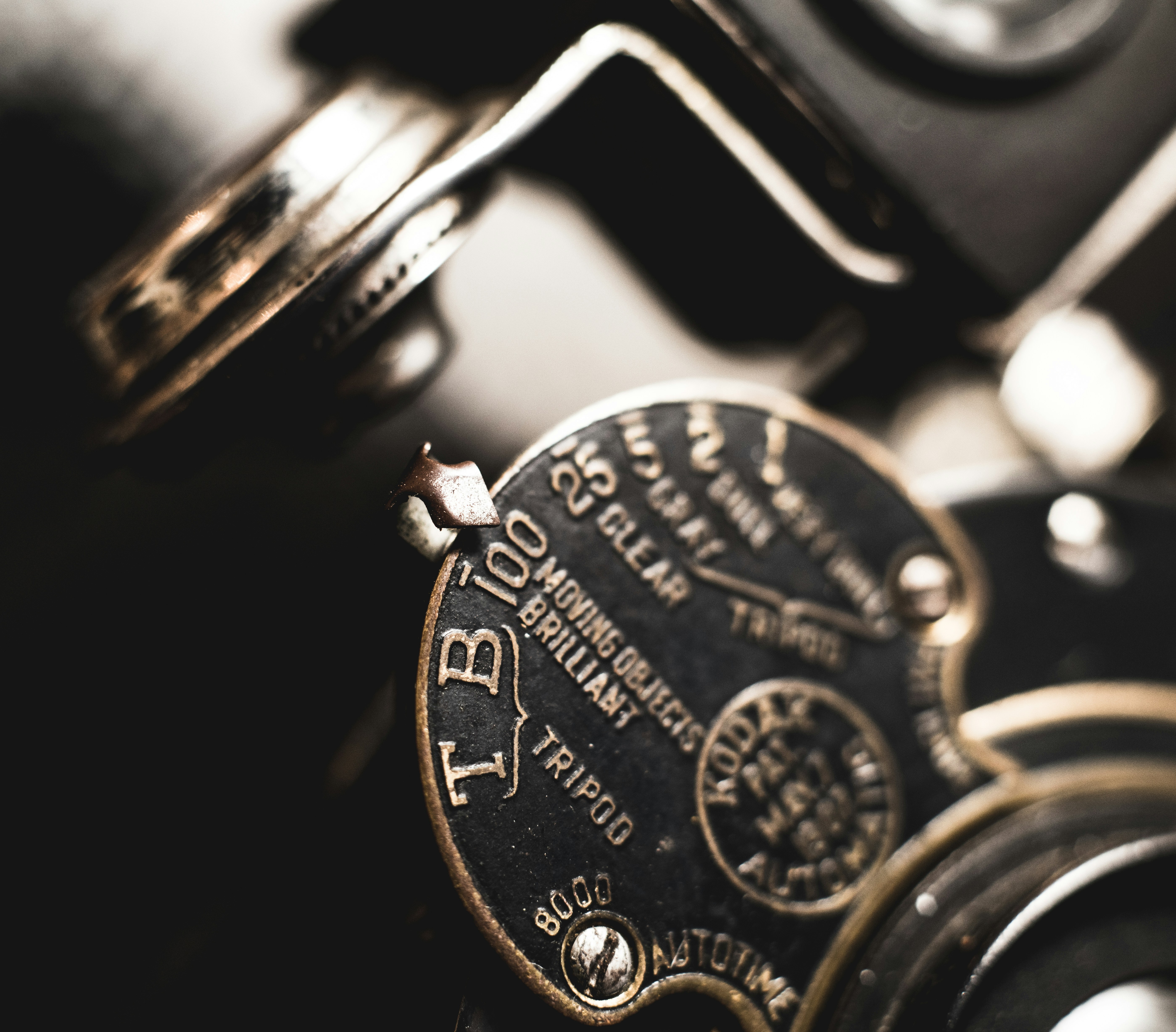 a close up of a typewriter with a clock on it