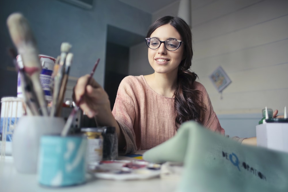 woman holding paint brush