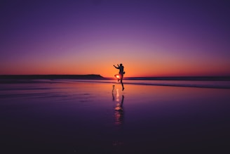 A couple enjoying a romantic beach sunset in Goa.