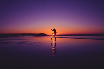 Couples enjoying a romantic sunset dinner on the beach.