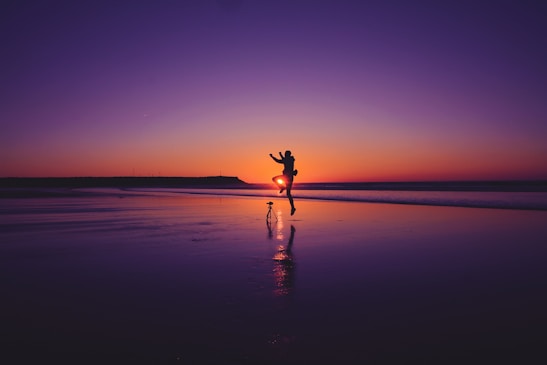 A lovely couple enjoying a sunset during their honeymoon trip.