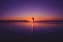 Romantic couple enjoying a sunset on an exotic international beach