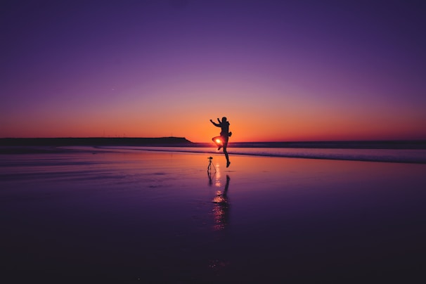 A couple enjoying a romantic beach sunset in Goa.
