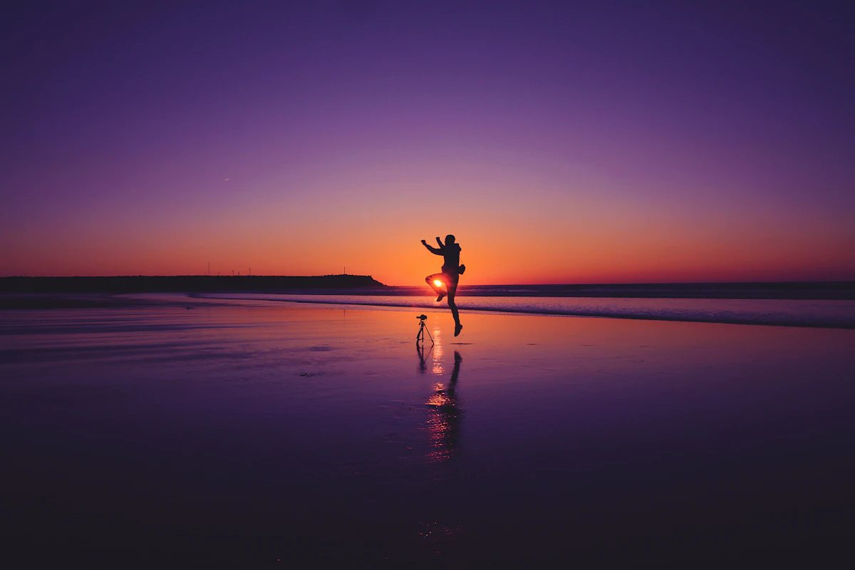 Person walking a forest path at dusk