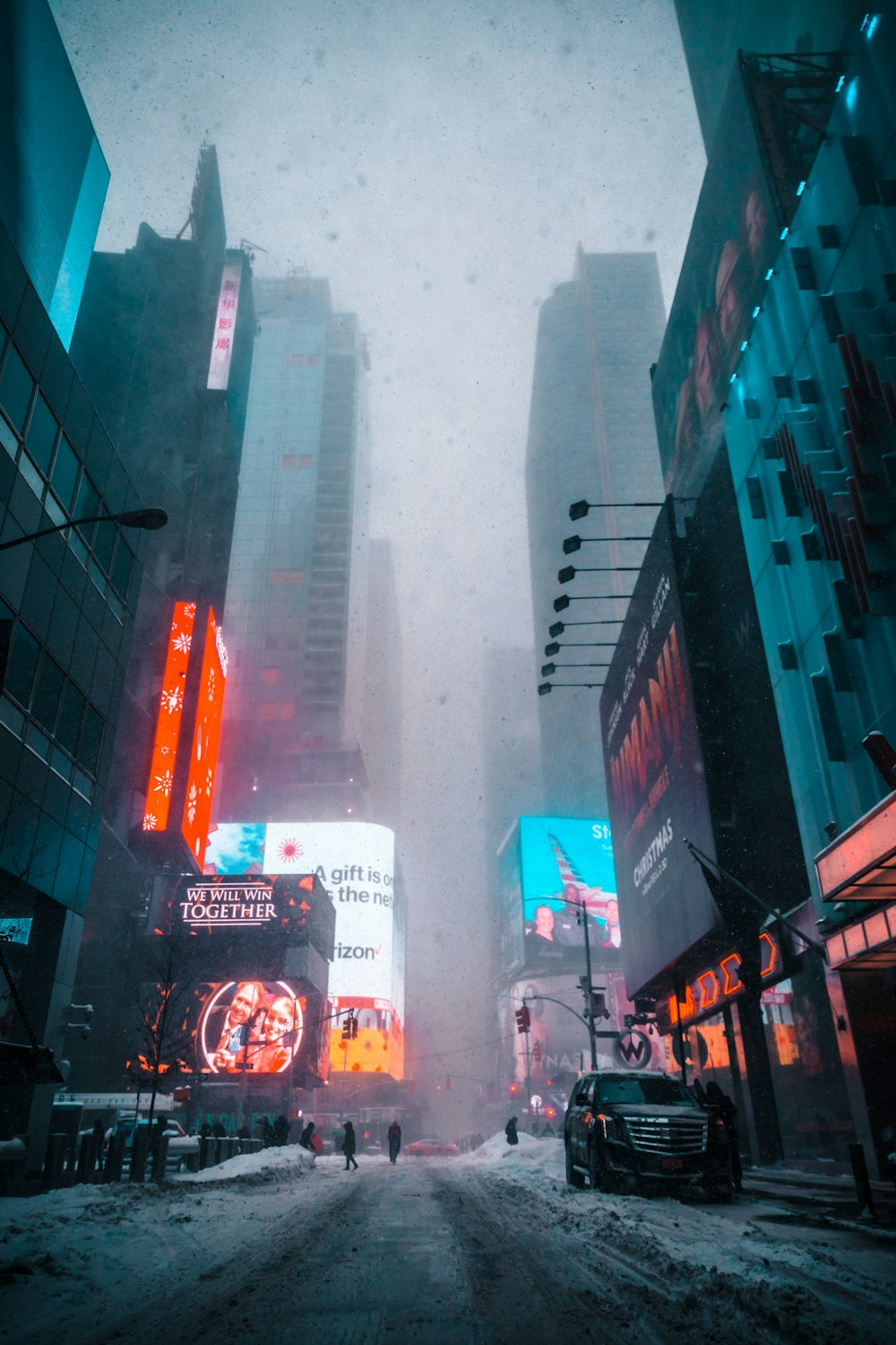 people waling on street covered with fog